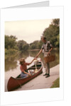 1960s Young Couple Loading Picnic Basket Thermos Into Canoe by Anonymous