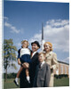 1960s Portrait Family Standing Together In Front Of Church Outdoor by Anonymous