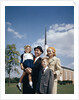 1960s Portrait Family Standing Together In Front Of Church Outdoor by Anonymous