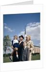 1960s Portrait Family Standing Together In Front Of Church Outdoor by Anonymous