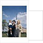 1960s Portrait Family Standing Together In Front Of Church Outdoor by Anonymous