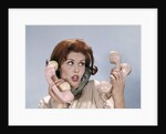 1960s Frustrated Young Redheaded Woman Trying To Answer Handle Five Telephone Receivers Studio by Anonymous