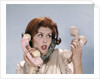 1960s Frustrated Young Redheaded Woman Trying To Answer Handle Five Telephone Receivers Studio by Anonymous