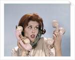 1960s Frustrated Young Redheaded Woman Trying To Answer Handle Five Telephone Receivers Studio by Anonymous
