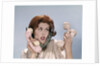 1960s Frustrated Young Redheaded Woman Trying To Answer Handle Five Telephone Receivers Studio by Anonymous
