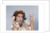 1960s Frustrated Young Redheaded Woman Trying To Answer Handle Five Telephone Receivers Studio by Anonymous