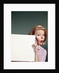 1960s Portrait Of Surprised Woman Peeking Around Sign Board by Anonymous