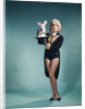1960s Young Woman In Stage Magician Coat And Short Shorts Pulling Rabbit Out Of Top Hat by Anonymous