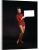 1960s Young Woman In Red Devil Costume Holding Sign Board In Hands by Anonymous