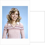1970s Portrait Curly Woman Wearing Pink Stripe Sweater by Anonymous