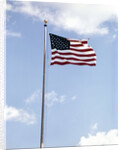 1960s American Flag On Pole Flying Against Blue Sky With Clouds by Anonymous