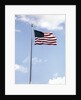 1960s American Flag On Pole Flying Against Blue Sky With Clouds by Anonymous