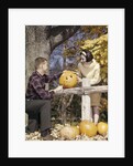 1960s Young Couple Man Woman In Autumn Woods Carving Halloween Jack-O-Lantern Pumpkin by Anonymous