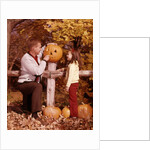 1960s Man Father And Girl Daughter Carving Halloween Jack-O-Lantern Pumpkin by Anonymous