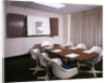 1960s Office Conference Room With Table Chairs Writing Pads Ashtray And Wall Chart by Anonymous
