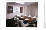 1960s Office Conference Room With Table Chairs Writing Pads Ashtray And Wall Chart by Anonymous