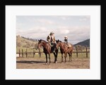 1970s Father And Son Sitting Together On Horses By Corral Wearing Hats by Anonymous
