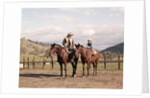 1970s Father And Son Sitting Together On Horses By Corral Wearing Hats by Anonymous