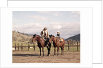 1970s Father And Son Sitting Together On Horses By Corral Wearing Hats by Anonymous