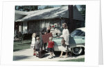 1950s 1960s Suburban Family Loading Ford Four Door Sedan Automobile For Trip by Anonymous