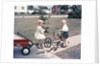 1950s Little Girl Sister Holding Doll Watching Little Boy Brother Repair Tricycle by Anonymous