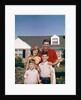 1960s Portrait Family Father Mother Two Sons Standing Together In Front Of Suburban House by Anonymous