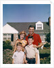 1960s Portrait Family Father Mother Two Sons Standing Together In Front Of Suburban House by Anonymous