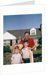 1960s Portrait Family Father Mother Two Sons Standing Together In Front Of Suburban House by Anonymous