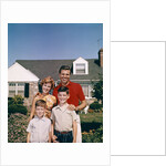 1960s Portrait Family Father Mother Two Sons Standing Together In Front Of Suburban House by Anonymous