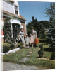 1940s 1950s Family Father Mother Daughter Son Leaving Suburban House Carrying Luggage by Anonymous