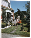 1940s 1950s Family Father Mother Daughter Son Leaving Suburban House Carrying Luggage by Anonymous