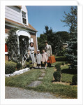 1940s 1950s Family Father Mother Daughter Son Leaving Suburban House Carrying Luggage by Anonymous
