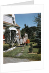 1940s 1950s Family Father Mother Daughter Son Leaving Suburban House Carrying Luggage by Anonymous
