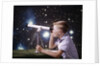 1960s Composite Boy With Telescope On Table Looking At Night Sky With Stars Galaxy Nebula by Anonymous