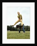 1970s Two Boys Jumping Playing Leapfrog by Corbis