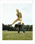 1970s Two Boys Jumping Playing Leapfrog by Corbis