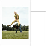 1970s Two Boys Jumping Playing Leapfrog by Anonymous