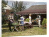 1960s Two Teenaged Couples Having Barbecue In Suburban Backyard by Anonymous