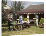 1960s Two Teenaged Couples Having Barbecue In Suburban Backyard by Anonymous