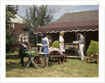 1960s Two Teenaged Couples Having Barbecue In Suburban Backyard by Anonymous