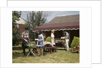 1960s Two Teenaged Couples Having Barbecue In Suburban Backyard by Anonymous