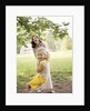 1970s Woman Mother With Girl Daughter Swinging Playing On Rope Swing by Anonymous