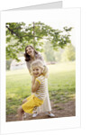 1970s Woman Mother With Girl Daughter Swinging Playing On Rope Swing by Anonymous