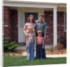 1970s Family Posing On Front Lawn Outside House by Anonymous