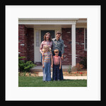 1970s Family Posing On Front Lawn Outside House by Anonymous