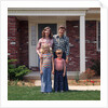 1970s Family Posing On Front Lawn Outside House by Anonymous