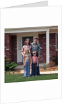 1970s Family Posing On Front Lawn Outside House by Anonymous