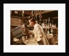 1960s Scientist Lab Technician Looking Into Oscilloscope In Laboratory by Anonymous