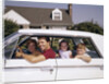 1960s Father And Mother With Son And Daughter Sitting In White Four Door Sedan Automobile by Anonymous