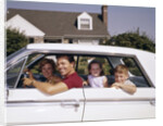 1960s Father And Mother With Son And Daughter Sitting In White Four Door Sedan Automobile by Anonymous